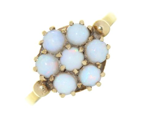 AN OPAL CLUSTER RING IN 9CT GOLD, LONDON 1967, 2.5G, SIZE M ½  NO DAMAGE TO OPALS. LIGHT WEAR CONSISTENT WITH AGE AND USE.