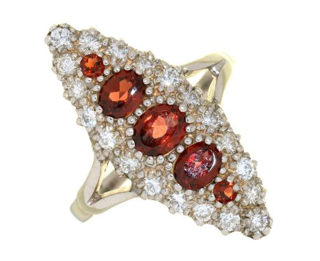 AN ALMANDINE GARNET AND DIAMOND MARQUISE STYLE TRIPLE CLUSTER RING IN WHITE GOLD, MARKED 15CT, 3.8G, SIZE L ½  IN GOOD CONDIT