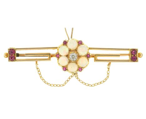 AN OPAL, DIAMOND AND RUBY BAR BROOCH IN GOLD, 50 MM W, UNMARKED, 5.8G  NO DAMAGE TO STONE. LIGHT SURFACE WEAR CONSISTENT WITH