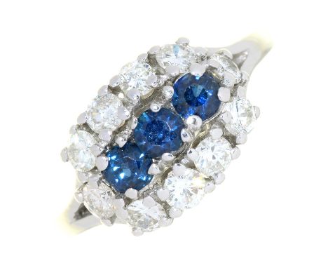 A SAPPHIRE AND DIAMOND TRIPLE CLUSTER RING IN WHITE GOLD, MARKED 18CT, 5G, SIZE N  MINOR ABRASIONS TO SAPPHIRE FACETS, NO APP