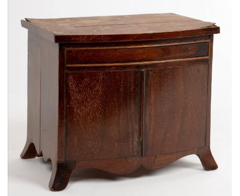 MINIATURE FURNITURE.&nbsp;A GEORGE III STYLE MINIATURE BOW FRONTED MAHOGANY AND LINE INLAID COMMODE WITH BLIND DRAWER AND DOO