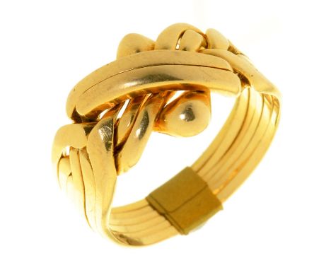 A GOLD PUZZLE RING, MARKED 18K, 10.5G, SIZE U ½  LIGHT SURFACE WEAR CONSISTENT WITH AGE AND USE