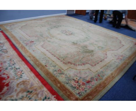 AN AXMINSTER LARGE BORDERED CARPET OF TRADITIONAL AUBUSSON DESIGN, with circular centre medallion of pink roses within a fram
