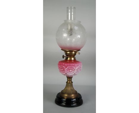 VICTORIAN BRASS AND FADING PINK GLASS OIL TABLE LAMP, of typical form with later orbicular floral etched glass shade, reservo