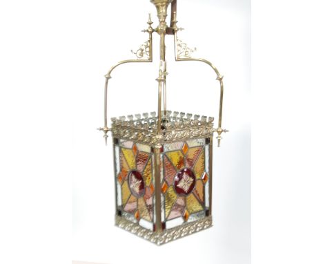 LATE VICTORIAN BRASS AND STAINED LEAD GLASS HALL LANTERN, the oblong shade with central domed ruby stained roundels, flash cu