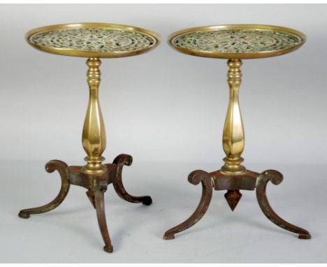 A PAIR OF EARLY VICTORIAN 'COUNTRY HOUSE' STYLE CAST BRASS AND IRON 'TABLE' FORM TRIVETS, the circular dished tops pierced wi