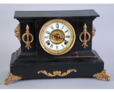 EARLY TWENTIETH CENTURY BLACK JAPANNED METAL AND GILT METAL MANTEL CLOCK, the 4 1/2" Roman dial (cracked), powered by a sprin