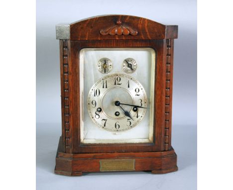 EARLY 20th CENTURY OAK CASED MANTEL CLOCK WITH (GERMAN) UNGHANS THREE TRAIN CHIMING MOVEMENT, the silvered dial with arabic n