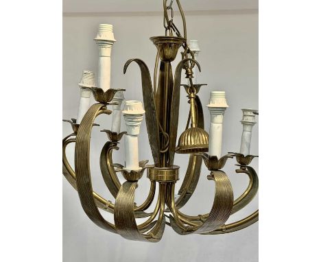 An eight branch brass electrolier, late 20th century, each branch cast as a leafy frond with flowerhead lamp holders, height 