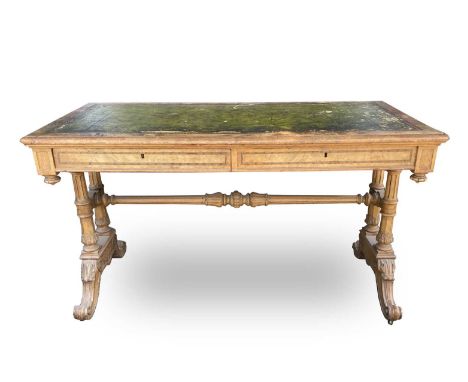 A Victorian walnut and inlaid Gothic style writing table, with leather inset skiver, within an inlaid border, fitted two draw