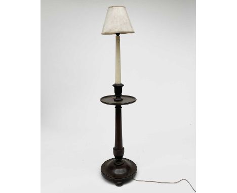 A mahogany standard lamp, 1920s, in the style of a Georgian candle stand, with white painted stem and with a dish turned plat