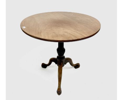 A George III mahogany tripod table, the circular top on a fluted baluster stem and cabriole legs, height 73cm, diameter 77cm.