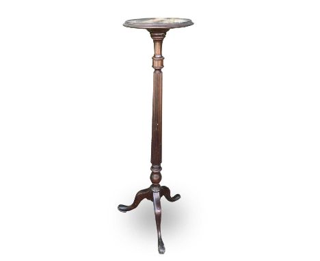 A mahogany torchere, of George III design, 1920s, with turned and fluted column on tripod base, height 122cm.