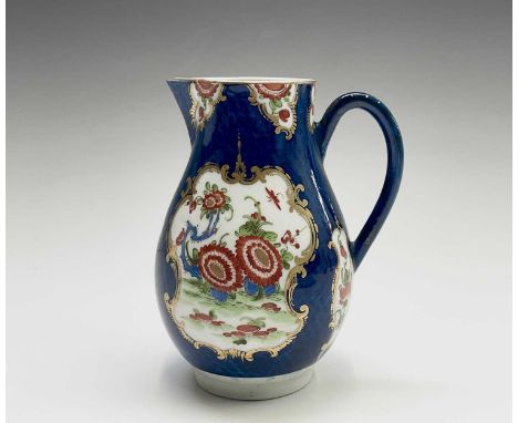 A Worcester jug, circa 1770, the blue scale ground decorated with gilt edged floral panels, crescent mark, height 12cm.Proven