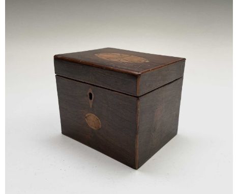 A George III mahogany tea caddy, with oval inlaid patera panels, the cover opening to reveal two lidded sections. Height 10.5