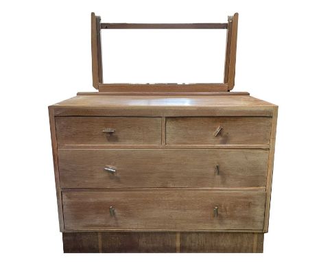 A 1930s/40s limed oak dressing table with adjustable mirror, fitted two short and two long drawers, width 106cm, together wit