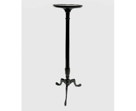 A mahogany torchere, George III style, with a dished top on a turned pillar and tripod base, height 124cm, diameter 30.5cm.