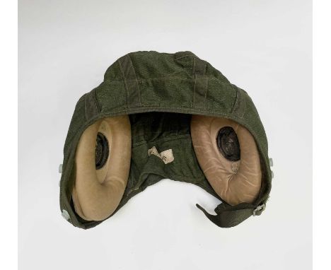 A green canvas and leather pilot's flying helmet, size 3, with stitched in ministry label, stamped P&amp;S W 22C/1301767 and 