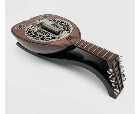 A Rare Reuge music box, in the form of a lute, complete with manual and fitted box.This was given as a present given by a mem