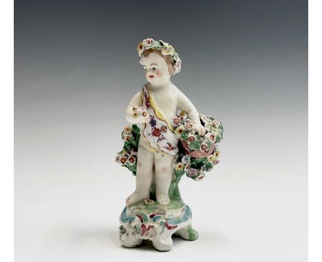 A late 18th century Derby porcelain figure of a cherub with floral encrusted decoration, height 13.5cm, together with a Staff