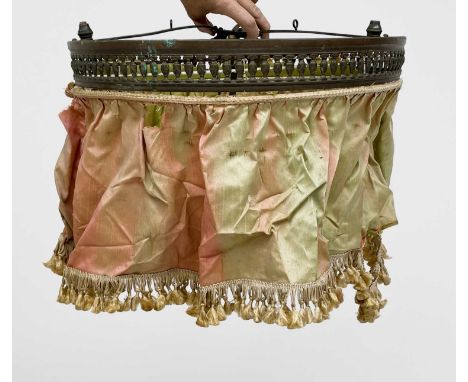 A gilt metal ceiling light, 1920s, with urn pierced decoration and coloured silk shade, diameter 47cm.