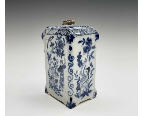 A Dutch Delft tea caddy, 18th century, of rectangular section, painted in blue and white with Chinese inspired figures and bi
