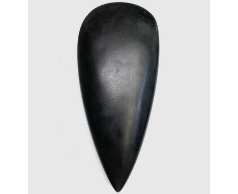 A Neolithic style polished stone axe head, length 16cm, width 7cm.