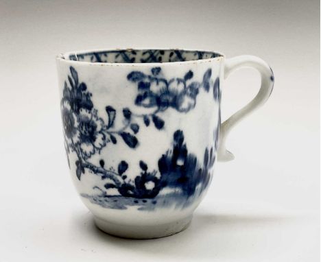 A Lowestoft blue and white porcelain coffee cup, circa 1780, painted with a rock, flowering peony and a moth, height 6.2cm.Co
