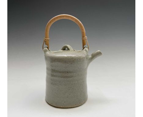 A John Reeve (1929-2012, ex Longlands Pottery, Hennock, Devon, c. 1968-1970) stoneware teapot with bamboo handle. Maximum hei