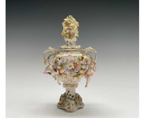 An early 20th century Dresden porcelain twin handled pot pourri vase and cover, the central printed and painted floral reserv