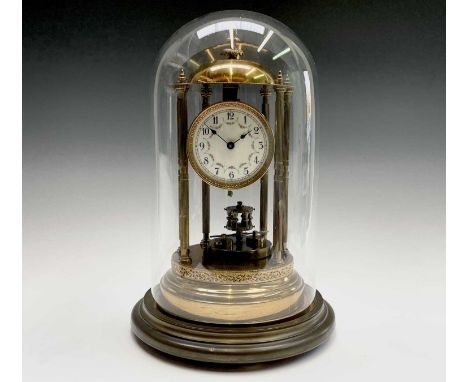 A 400 day brass torsion mantel clock, of portico type, with domed top, floral garland decorated dial and six fluted column su