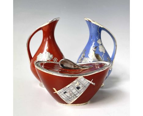 An Art Deco period Veyhl silver overlay porcelain ewer, the blue ground with applied bird and floral branch decoration, heigh