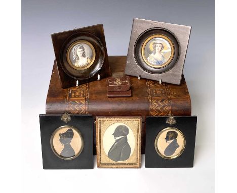 A mid-19th century silhouette portrait of a gentleman, heightened in gilt and white, 6.5X5.5cm, together with two other silho