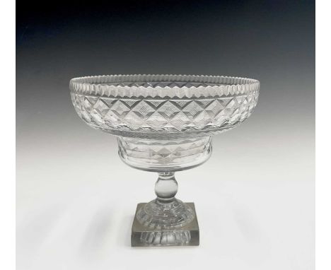 A Georgian cut glass pedestal bowl, with serrated rim, hobnail cut lozenges and lemon squeezer base, height 21cm, diameter 23