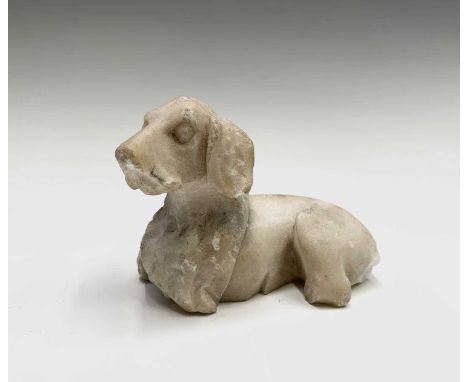 An early 19th century carved marble sculpture of a recumbent dog, length 8cm, a late 19th/early 20th century glass vase with 
