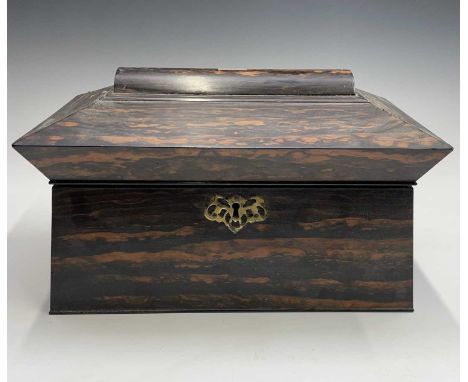 An early Victorian coromandel wood tea caddy, of sarcophagus shape, with glass mixing bowl and twin lidded compartments, widt