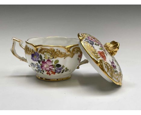 A Meissen blue and white onion pattern plate, diameter 24.5cm, together with a Dresden Floral decorated ribbon plate, a Meiss