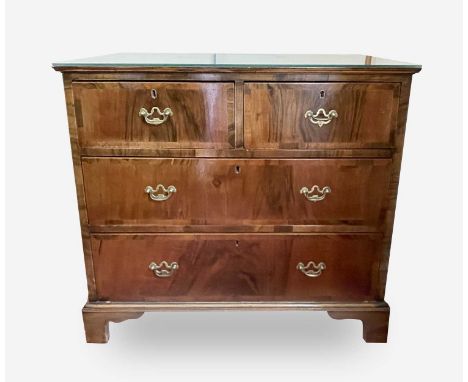 An 18th century walnut and crossbanded chest of two short and two long drawers on bracket feet, height 82cm, width 90cm, dept