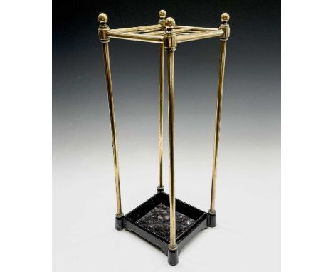 A Victorian brass stick and/or umbrella stand with cast iron drip tray. Height 59cm, width 22cm, depth 20cm.