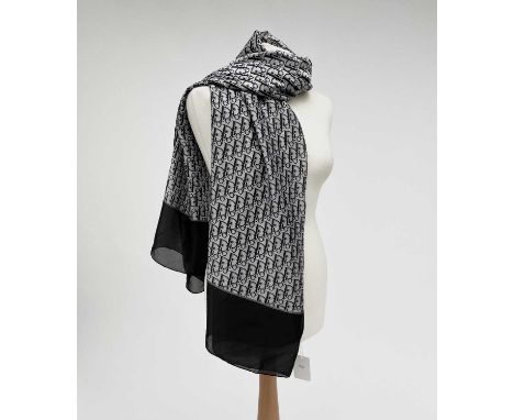A Christian Dior monochrome monogram design silk scarf, with tags. 90 x 177cm.Condition report: As new condition