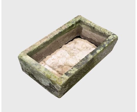 A carved stone trough planter of rectangular form. Height 17cm, width 69cm, depth 40cm.