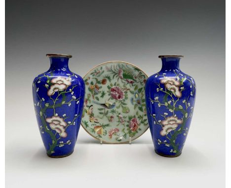 A pair of Japanese cloisonne enamel vases, 20th century, decorated with flowering prunus on a blue ground, height 18.5cm, tog