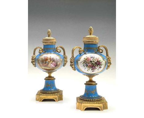 A pair of French 'Sevres' porcelain ormolu mounted cassolettes, late 19th century, with horned mask handles and reversible co