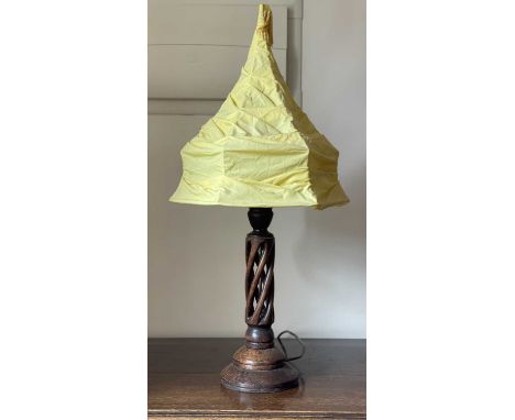 A 1930's oak table lamp, with open spiral work stem, total height 75cm.