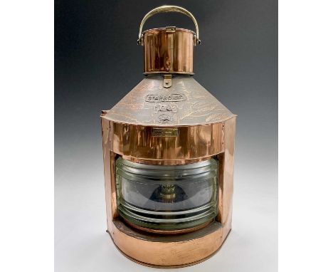 A ship's copper starboard lamp, with applied brass labels and patents, with burner, height 56cm.