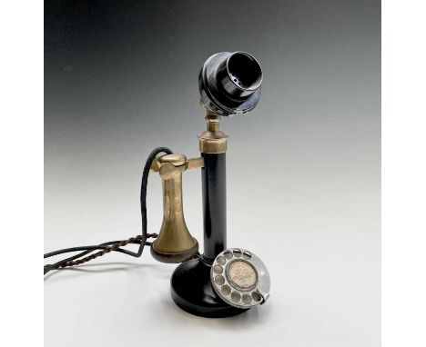 A brass, painted metal and bakelite candlestick telephone, stamped PX150, height 33cm.