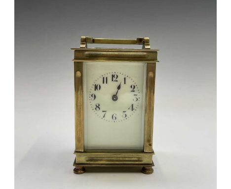 A French brass cased carriage clock, early 20th century, on turned feet, height 12.5cm.
