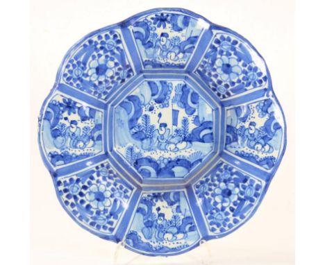 A DUTCH DELFTWARE BUCKELPLATTE PAINTED IN WANLI STYLE WITH FIGURES AND FLOWERS 25.5CM DIAM 18TH CENTURY
