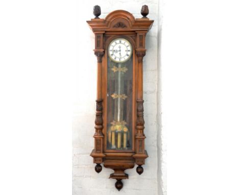 A LIGHT WALNUT 'VIENNA' REGULATOR WITH THREE TRAIN MOVEMENT AND ENAMEL DIAL 133CM H EARLY 20TH CENTURY