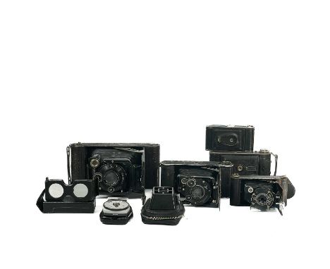 Five vintage cameras used by W.A.B Leach. On his travels around Asia and a light meter.Provenance: From the estate of William